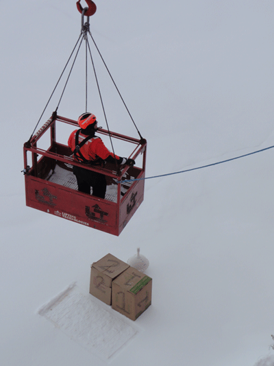 Boxes one and two are deployed on the ice with the tracker and the sip crew is pulled back up to the Healy. (Photo T. Kenna) 