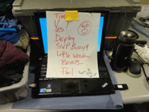A note on the computer station of Tim Kenna announces that it is time to deploy the  'Float Your Boat' project.  