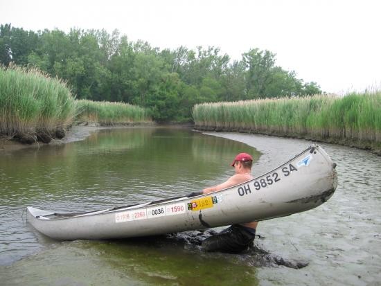 Reclaiming capsized canoe.
