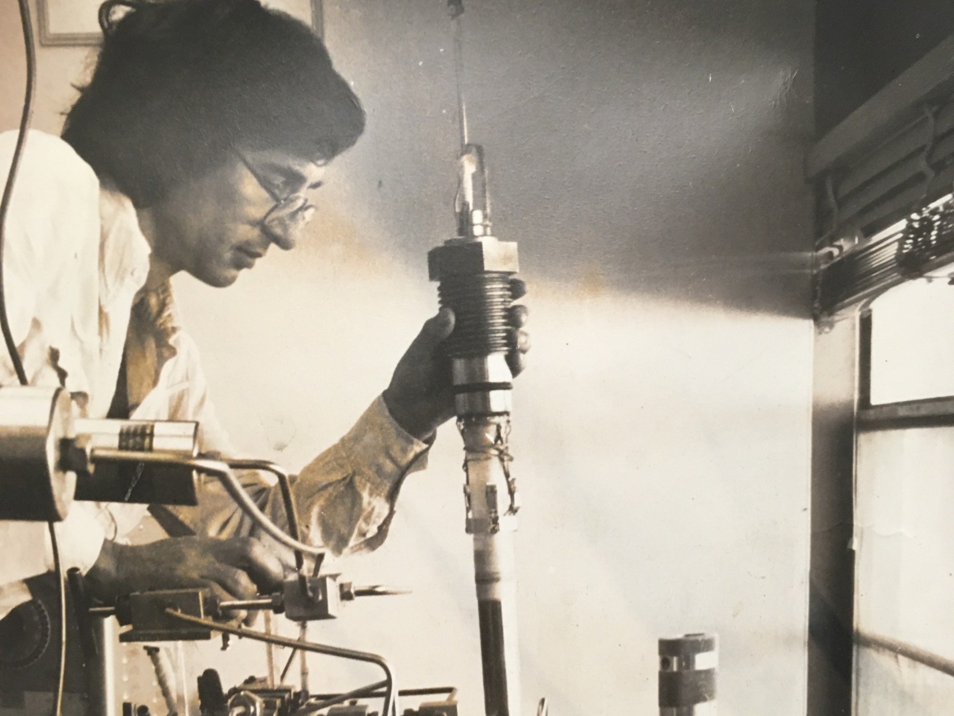 Chris Scholz loading a sample into the top of a triaxial apparatus...one of several he used to have in the lab (~1975).