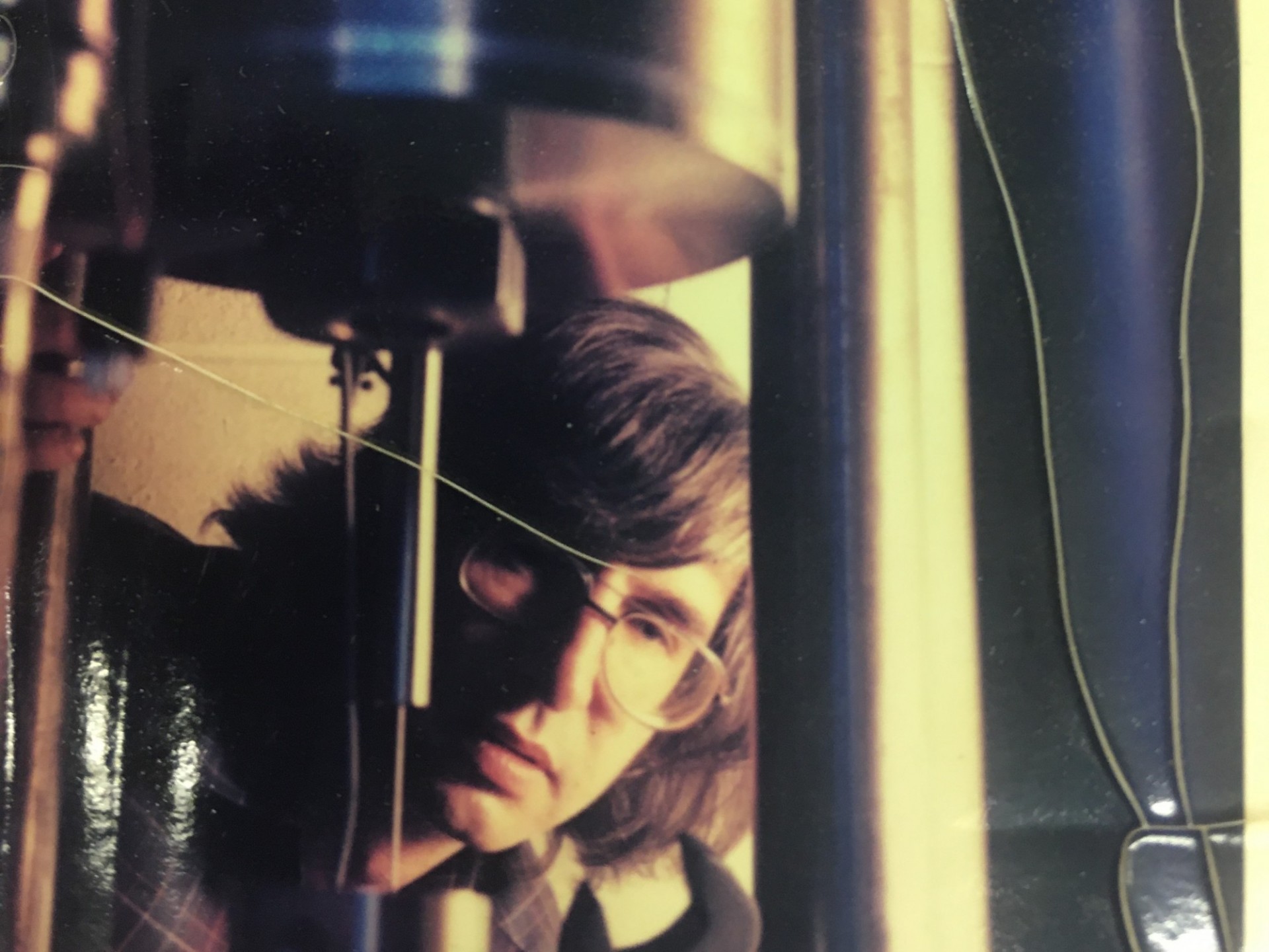 Chris Scholz peeping underneath the pressure cell on the triax for a magazine photo shoot (~1970s)