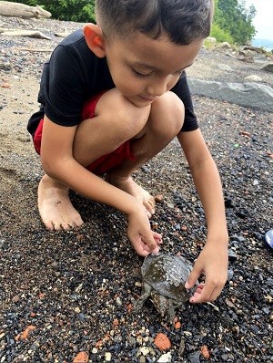 Young boy from Haverstraw. In his eyes, you could see the awe he had for the soft shell turtle we netted and how he carried it in such a reverent way, trying to make sure that it didn’t get hurt and keeping it near the water. 