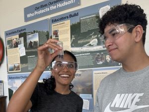 Next Gen Interns, Justin and Jane, analyze alkalinity test Next Gen Interns look at an alkalinity test sample