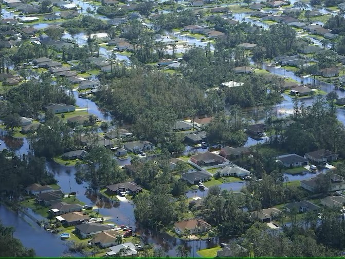 The day after Hurricane Ian made landfall, homes were surrounded by water in Fort Myers, Florida. Credit: AP Photo/Marta Lavandier