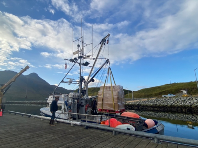Loading food and equipment on the Miss Alyssa at Dutch Harbor. Credit: Einat Lev