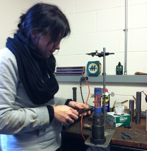 Visiting researcher Mandy Duda from Germany prepares a sample for the triax (2012).