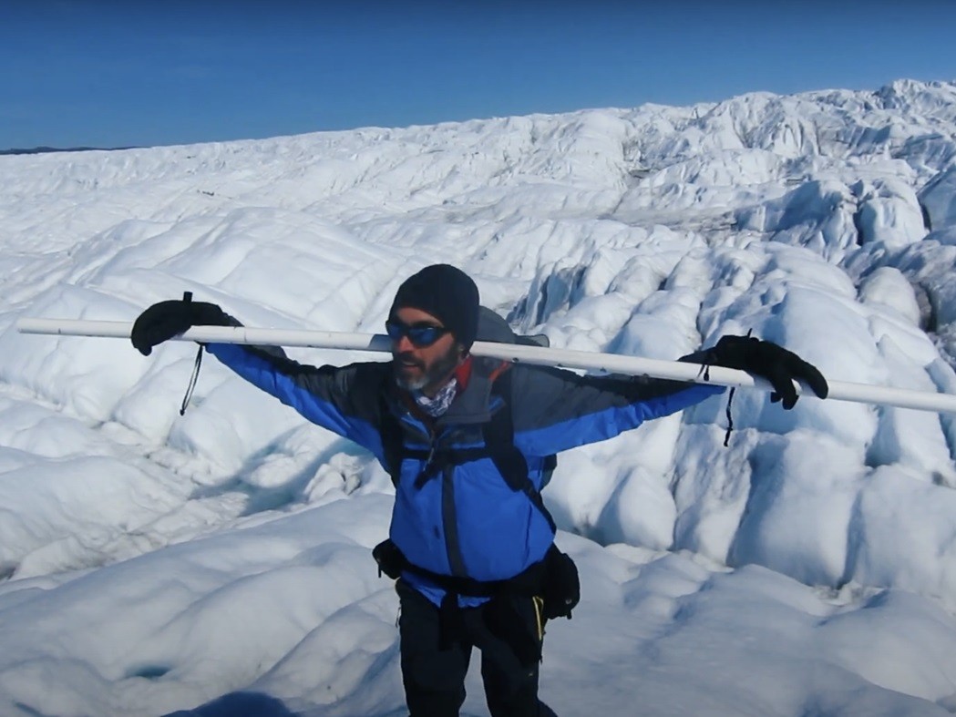 Polar scientist Marco Tedesco doing fieldwork on Greenland ice sheet.