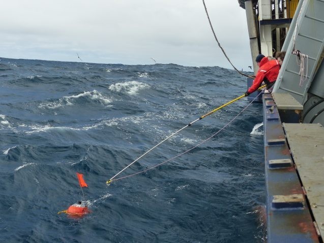 A researcher aboard Lamont-Doherty’s R/V Marcus G. Langseth recovers a seismic imaging sensor off New Zealand in 2018. The sensors enabled the creation of detailed geologic images of the newly forming subduction zone. Credit: University of Texas Institute for Geophysics