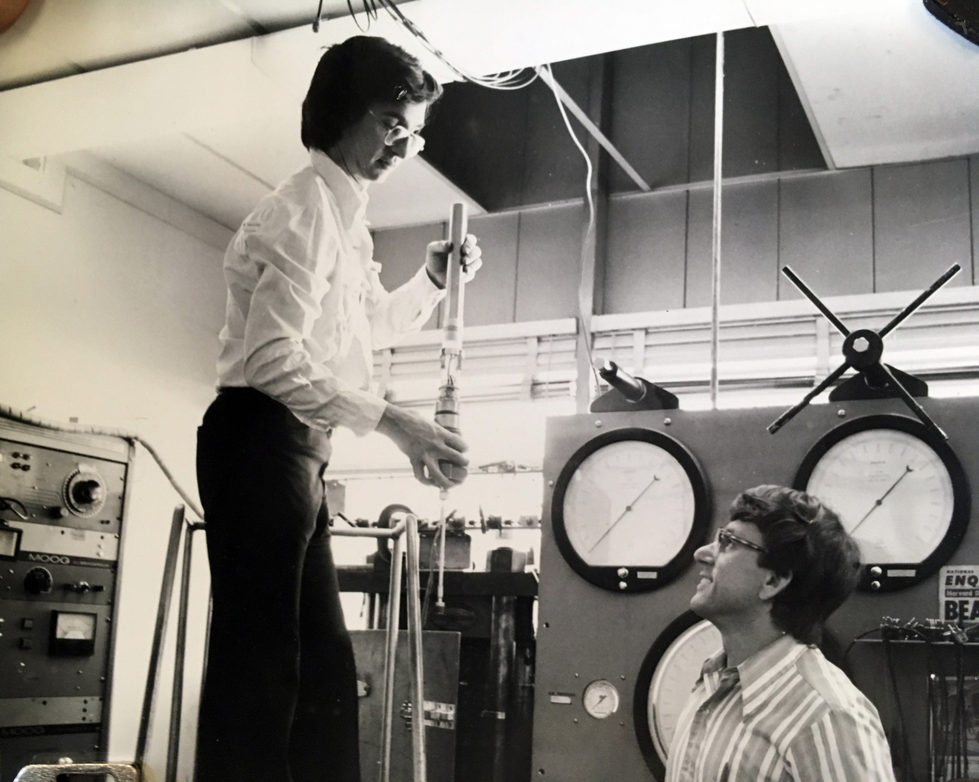 Chris Scholz loads a sample in the triax while Terry Englander looks on (1978).