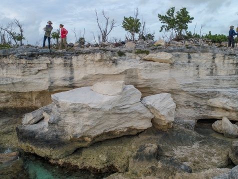 Surveying coastal rocks on the archipelago’s Crooked Island formed when sea levels were higher. Credit: Blake Dyer