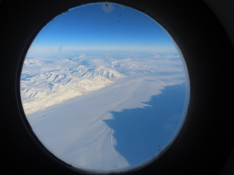 View of Antarctica from C-17 porthole. Credit: Jen Lamp