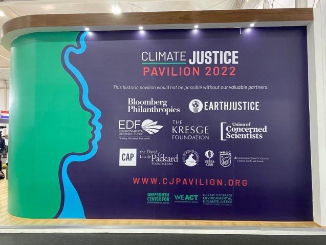 climate justice pavilion banner with climate school logo in lower right corner