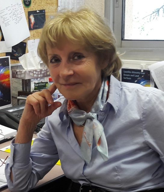 Anny Cazenave sitting at her desk