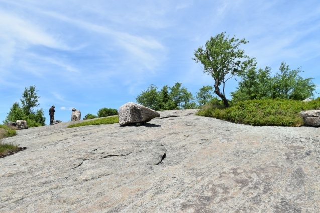 boulder sitting on top of bedrock