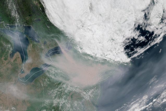 A satellite image captures thick smoke over the eastern U.S.