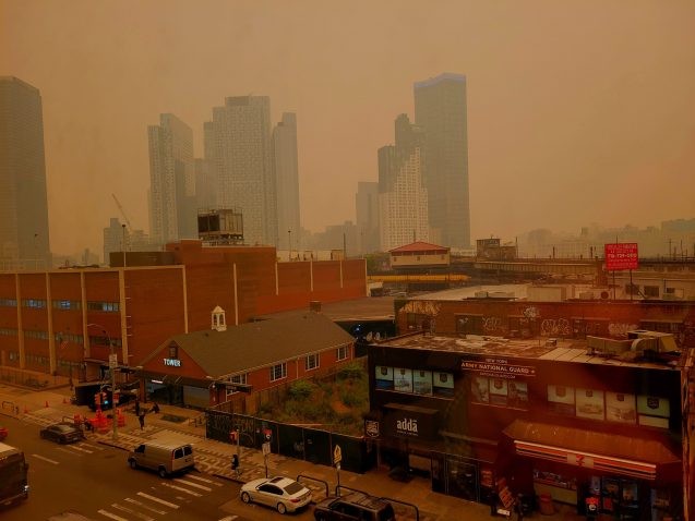 Thick smoke from Canadian wildfires darkens the sky in New York City. 