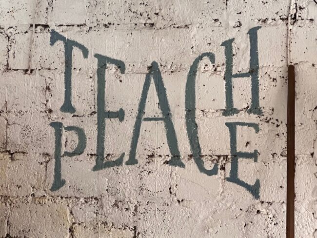 Wall in the city of Pokhara, Nepal that says Teach Peace (Joshua Fisher, AC4)