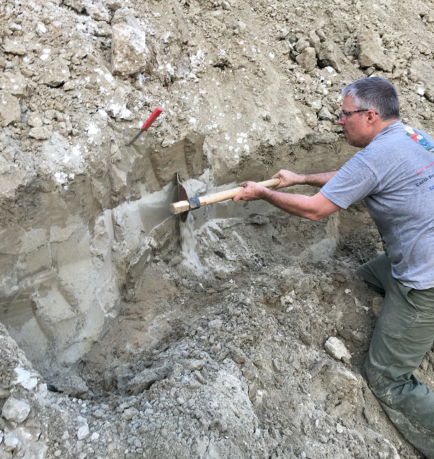 Steve Goodbred clears sediment from the muddy wall of a freshly dug pond in the Ganges floodplain of Bangladesh, revealing intrusive sand dikes.