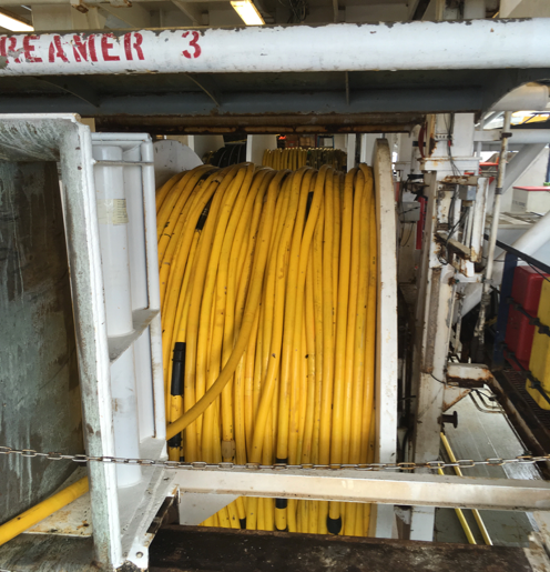 Photo of large spool of yellow cable streamers on board the R/V Langseth.