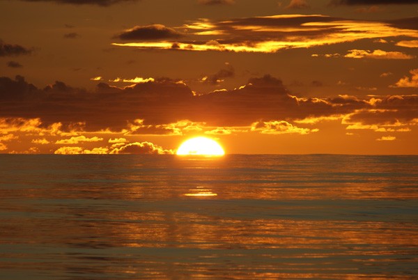 The sun sets over the calm waters above the East Pacific Rise. We saw many such settings of the sun that were just as beautiful as this one. (Photo by Wanda Vargas)