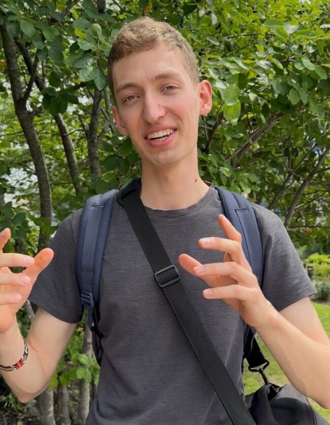 Student in front a of a tree