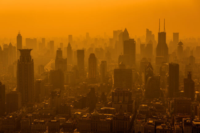 Air pollution in Shanghai, China - skyline photo, the sky is bright orange