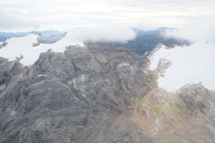 Carstensz glacier and East North-Wall Firn in Puncak Jaya, Papua-Indonesia taken from helicopter in August 27, 2008. Puncak Jaya is 4,884 m above mean sea level.