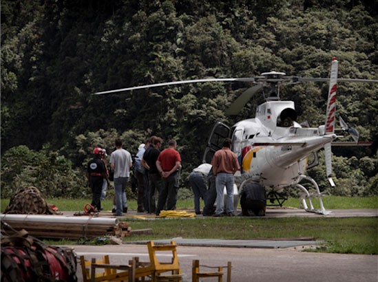 The team trains on how to load and unload helicopter slings safely. The helicopter will be used to transport ice cores to the mining town of Tembagapura, where they will be kept in food freezers before transport to Ohio State University.