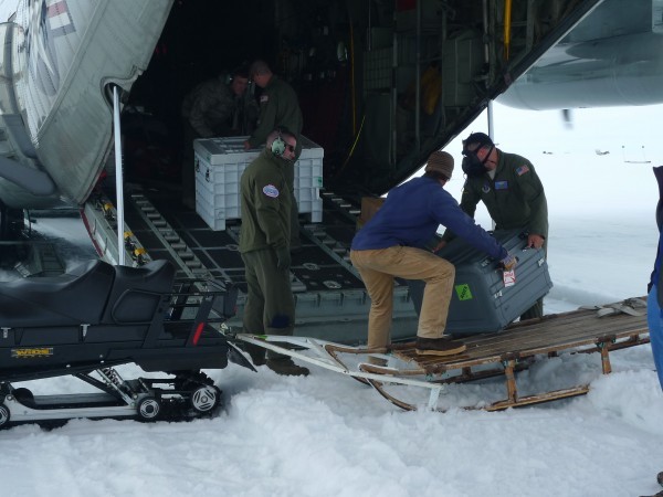 Cargo is loaded into the back of the LC130 at Raven Camp. The aircraft is not turn off during ice landing - all loading is done quickly. (Photo M. Turrin)