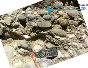 Tiny, flat stones tell us which way the river once ran. Credit: Meg Reitz.