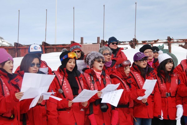 The Antarctic Forum chorus singing at our arrival at the station. (Photo Xiaojun Yuan)