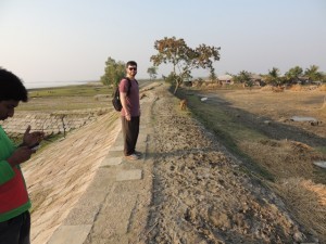 Allan walking on the embankment, or polder.  The land on the river side (left) is about a meter higher than on the inside of the polder.