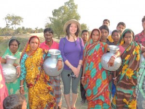 Soyee with some of the local women and their water jugs on Polder 32.