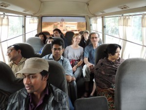 The American and Bangladeshi students, along with our instructors get to know each other on the bus as we transition from metropolitan traffic to driving by green rice fields.