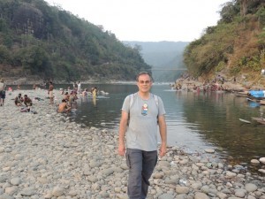 Standing in India by the Dauki River and Shillong Plateau at Jaflong..