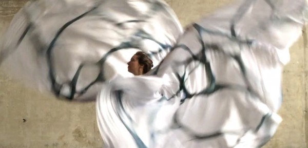 Jody Sperling performs "Arctic Memory" in a costume designed to mimic Arctic sea ice.