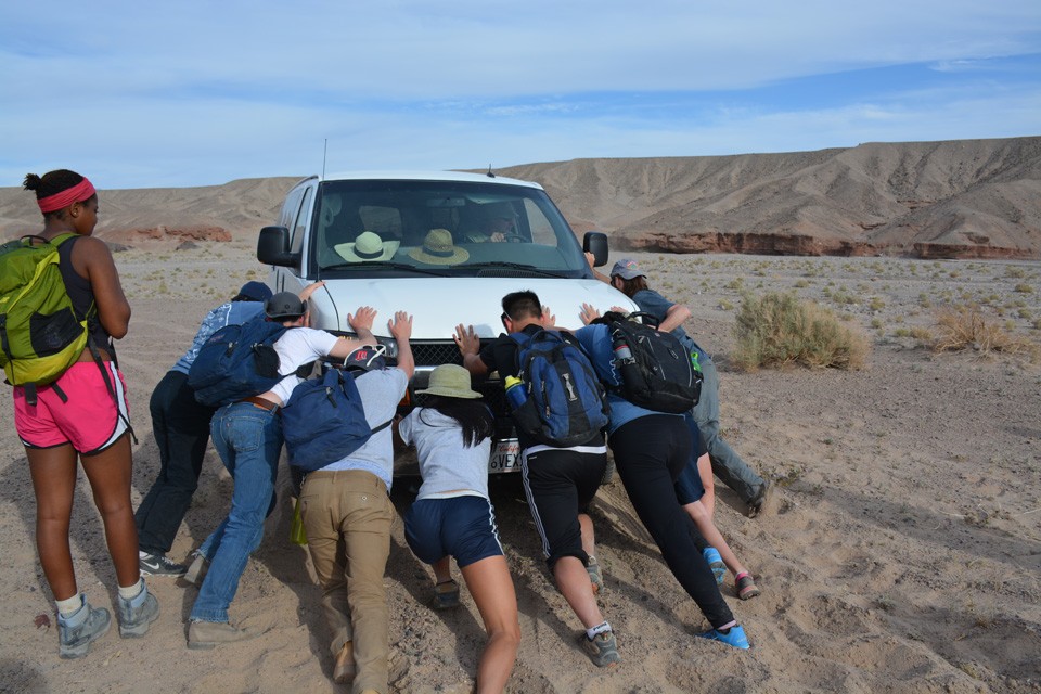 Any trip to the desert has its mishaps, and this one happened on the second to last day, when both vans got stuck in the sand at Sperry Wash. Putting their geology skills to use, the students jacked up the two vans, slid rocks under the rear wheels 20 van