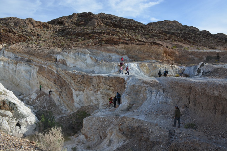 Extensive mining in the Basin and Range has left scars on the landscape, including this open-pit quarry in the Alexander Hills. The students are turned loose in the quarry and asked to figure out what used to be mined there, and how the mineral was f 21 talc