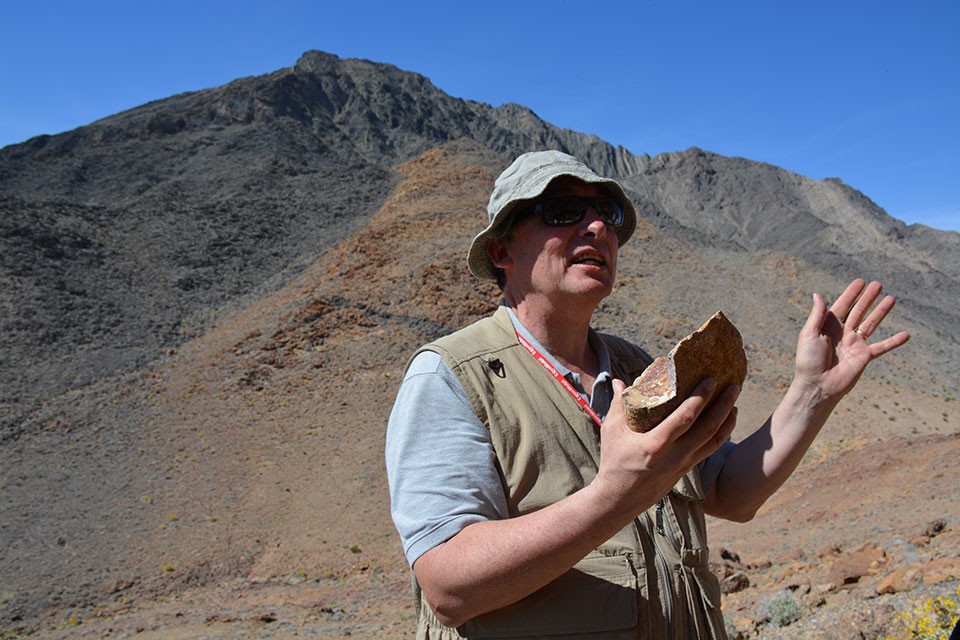The chunk of igneous rock in Christie-Blickâs hand plays a central role in an ongoing debate about how much earthâs crust has stretched in this region. The rockâs age and unique mineral composition indicates that it came from the Cotto NCB-w-far-off-rock resized