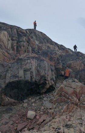 A look out is taken by our guides from on top of Alison Fjord's northern flank. (Photo M. Turrin)