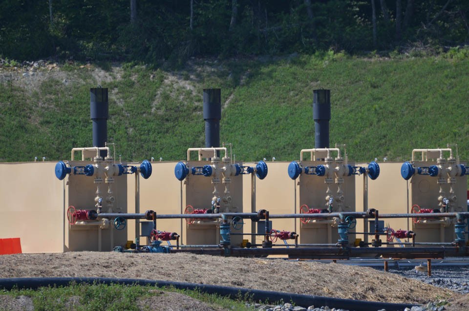 Volatile chemicals and gas, as well as hazardous natural substances from deep underground can reach air or water if a well is not working properly. Here, tanks at a newly drilled site await use. 3