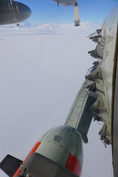 Icepod flies over the Antarctic ice with Mt. Erebus visible in the background. (Photo R. Bell)