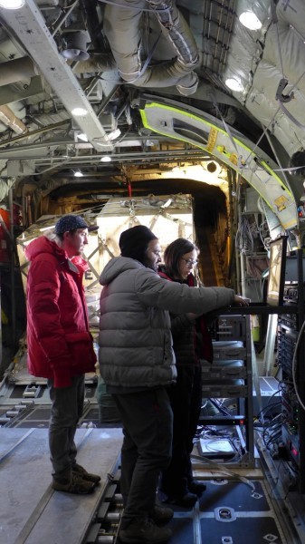 Scott Brown, Tej Dhakal and Winnie Chu prepare the equipment for take off. (photo R. Bell) 