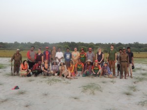Group photo on Egg Island.  We stand at the transition from sand to grass while behind us the entire succession to mangroves is visible 