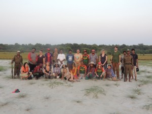 Group photo on Egg Island. We stand at the transition from sand to grass while behind us the entire succession to mangroves is visible