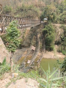 The temporary bridge over a river replacing the one that collapsed from an overweight truck last fall.  There is a new solid bridge being built just to the left. This is also along the route to the airport.