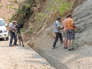 Doug Prose filming Nano, Paul and Humayun at an outcrop