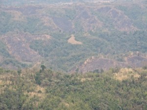 Landscape showing the scars of the traditional jum agriculture practice of burning to clear land for planting.