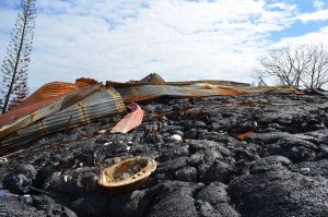 The remains of a house in the way of an ongoing lava flow near Pahoa, Hawaii. Volcanic eruptions are a way of life here. CLICK TO VIEW SLIDESHOW