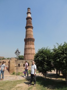 Standing in front of the 240-foot tall Qutub Minar, which dates from the 1200s.